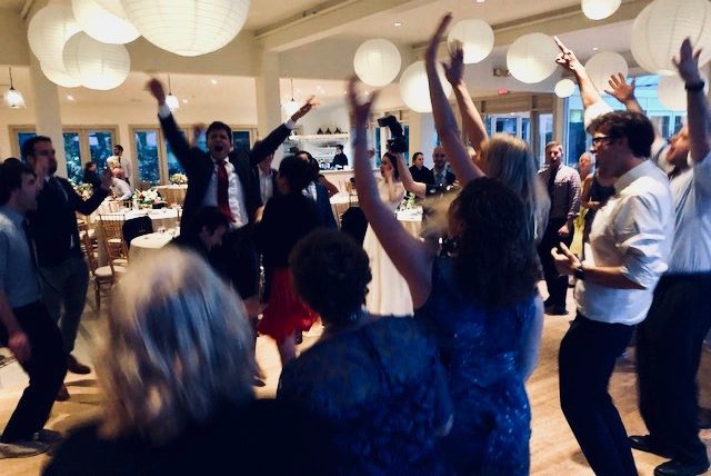 Guests enthusiastically dancing on the dance floor in New york city